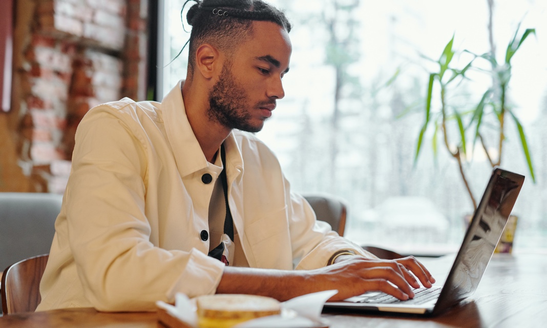 man is working on laptop